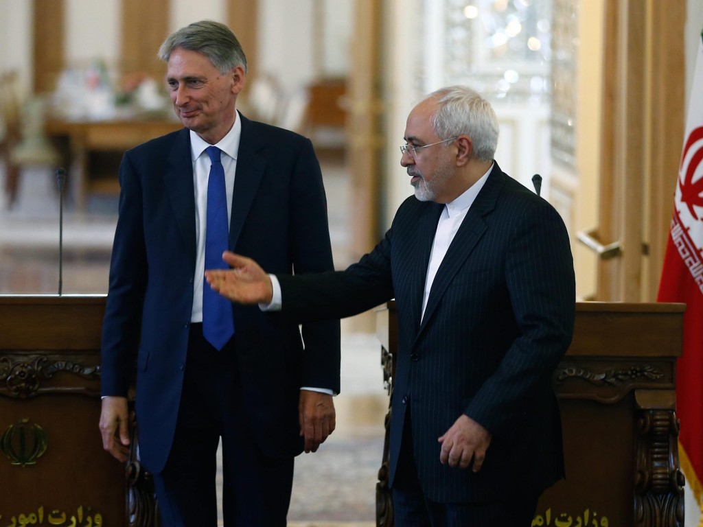 British Foreign Secretary Philip Hammond and Iranian Foreign Minister Mohammad Javad Zarif deliver a joint news conference following their meeting in Tehran, on Sunday, as the British embassy is reopened after being shuttered for nearly four years.